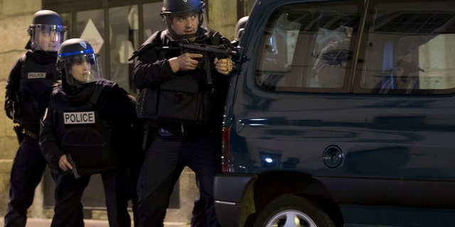 Nov. 15, 2015: French police secure the perimeter after panic broke out among mourners who payed their respect at the attack sites at restaurant Le Petit Cambodge (Little Cambodia) and the Carillon Hotel in Paris.