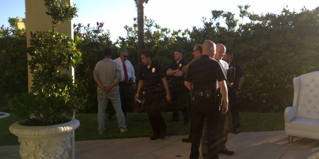 Paris Hilton photographed the man being arrested. (Twitpic)