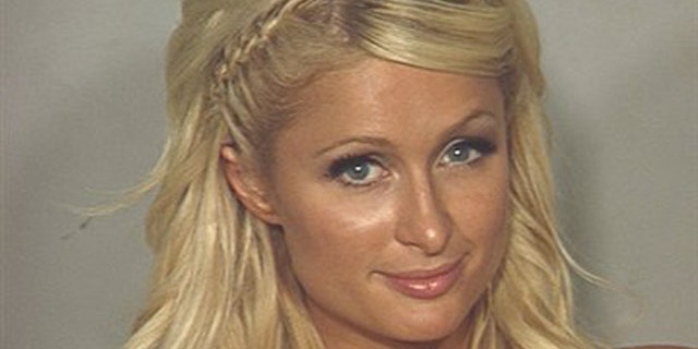 In this photo released Saturday, Aug. 28, 2010 by the Las Vegas Metropolitan Police Department, Paris Hilton is seen in her police booking photo in Las Vegas.