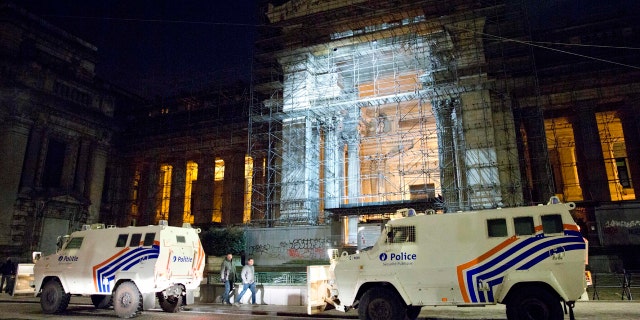 Police stand guard outside the trial of Salah Abdeslam at the Brussels Justice Palace.