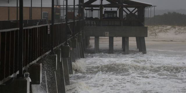 The remnants of Hurricane Patricia striking Gulf Shores, Alabama Monday. (Brian Kelly/Mobile Press-Register via AP)