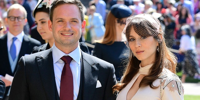 Patrick J. Adams and wife Troian Bellisario arrive a for the wedding ceremony of Prince Harry and Meghan Markle at St. George's Chapel in Windsor Castle in Windsor, near London, England, Saturday, May 19, 2018. (Ian West/pool photo via AP)