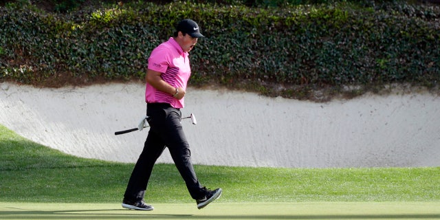 Patrick Reed reacts after making birdie at the 12th hole at the Masters Sunday.