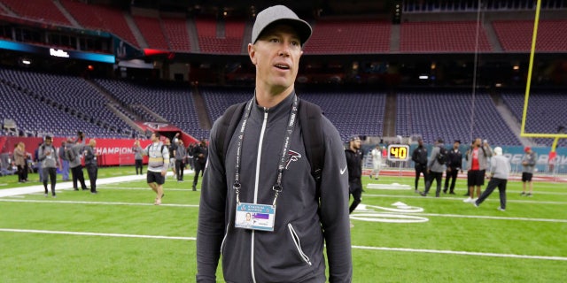 Atlanta Falcons quarterback Matt Ryan walks on the field during a visit to NRG Stadium for a walk through on the eve of NFL Super Bowl 51 football game Saturday, Feb. 4, 2017, in Houston.