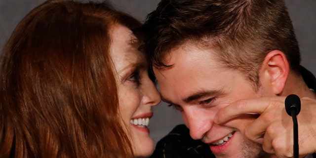 May 19, 2014. Cast members Robert Pattinson (R) and Julianne Moore attend a news conference for the film "Maps to the Stars" in competition at the 67th Cannes Film Festival in Cannes.