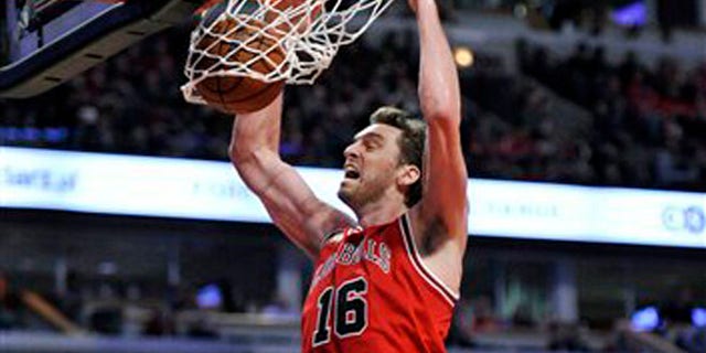 FILE - This is a Saturday, March 5, 2016 file photo of Chicago Bulls' Pau Gasol (16), of Spain, as he dunks during the second half of an NBA basketball game against the Houston Rockets on in Chicago. Chicago won 108-100. Pau Gasol says he is considering not playing at the Olympics because of the Zika virus. The Spanish basketball player says there is too much uncertainty about the situation in Brazil and anyone going to Rio de Janeiro for the games should "think about" whether it's worth the risk. (AP Photo/Paul Beaty, File)