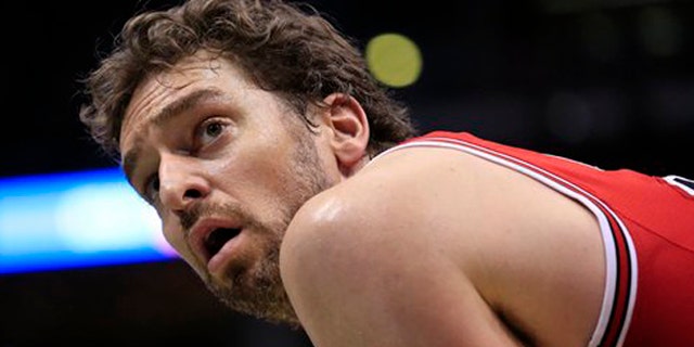 FILE - This is a Sunday, April 3, 2016 file photo of Chicago Bulls center Pau Gasol looks up as the Milwaukee Bucks take a free throw during the second half of an NBA basketball game, in Milwaukee . Pau Gasol says he is considering not playing at the Olympics because of the Zika virus. The Spanish basketball player says there is too much uncertainty about the situation in Brazil and anyone going to Rio de Janeiro for the games should "think about" whether it's worth the risk. (AP Photo/Darren Hauck, File)