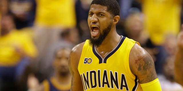 Indiana Pacers' Paul George reacts during the first half in Game 3 of a first-round NBA basketball playoff series against the Cleveland Cavaliers,Thursday, April 20, 2017, in Indianapolis. (AP Photo/Michael Conroy)