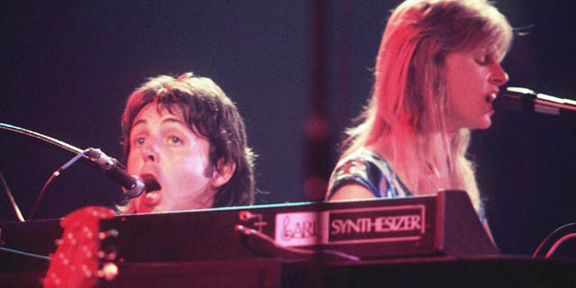 Bond's producer suggested Paul McCartney's vocal be replaced on 'Live and Let Die," thinking he was just a demo singer. Here McCartney sings with his late wife Linda in their band Wings.