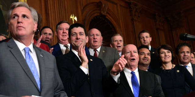 House Republicans, including House Majority Leader Kevin McCarthy of Calif., left, House Speaker Paul Ryan of Wis., fourth from right, and House Ways and Means Committee Chairman Rep. Kevin Brady, R-Texas, fifth from right, wait to start a news conference following a vote on tax reform on Capitol Hill in Washington, Thursday, Nov. 16, 2017. Republicans passed a near $1.5 trillion package overhauling corporate and personal taxes through the House, edging President Donald Trump and the GOP toward their first big legislative triumph in a year in which they and their voters expected much more.