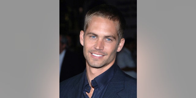 September 21, 2005. Actor Paul Walker arrives for the premiere of
"Into the Blue" at the Mann Village in the Westwood area of Los Angeles.