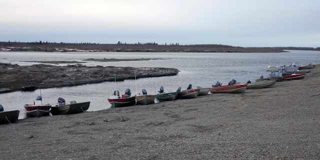 Fishing skiffs line the shore in New Stuyahok, Alaska, as seen in an undated handout picture provided by the Environmental Protection Agency (EPA).