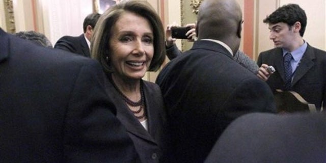 FILE: House Speaker Nancy Pelosi, D-Calif., heads to a television interview on Capitol Hill in Washington on Nov. 3.
