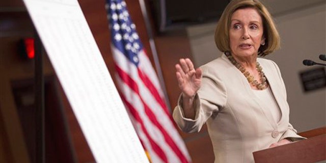 House Minority Leader Nancy Pelosi points to a chart during a news conference on Capitol Hill in Washington May 12.