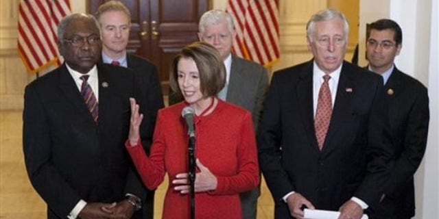 Democratic leaders, Speaker Nancy Pelosi, Majority Whip James Clyburn and Rep. Steny Hoyer, seen here in November, are working to limit losses of Democratic seats in the 2010 election, but recognize the historic challenges. In the back are Rep. Chris Van Hollen, Rep. John Larson and Rep. Xavier Becerra (AP Photo).