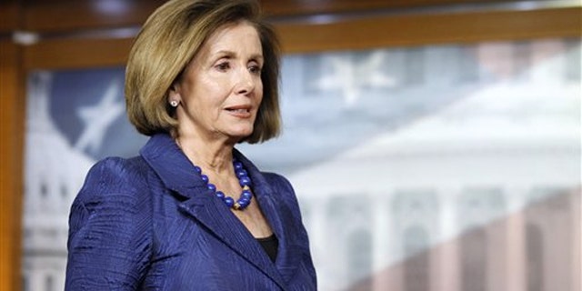 House Minority Leader Nancy Pelosi arrives for a news conference on Capitol Hill April 7.