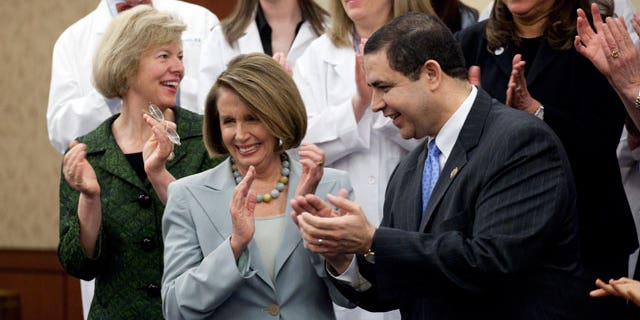 Rep. Tammy Baldwin, D-Wisc., Democratic Minority Leader, Nancy Pelosi, D-Calif., and Rep. Henry Cuellar, D-Tex., at a ceremony marking the one year anniversary of the passage of the Health Care Act on Capitol Hill in Washington on Thursday, March 17, 2011. (AP)