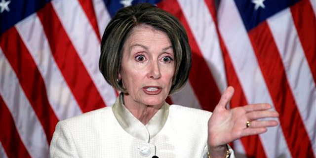 House Speaker Nancy Pelosi gestures during a news conference on Capitol Hill June 24. (AP Photo)