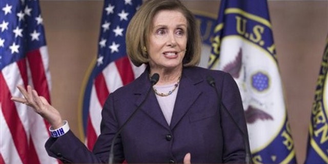 House Minority Leader Nancy Pelosi gestures during a news conference on Capitol Hill April 14.