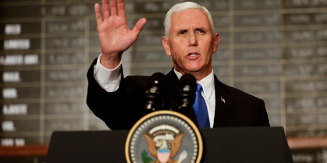 U.S. Vice President Mike Pence waves after speaking at the Buenos Aires Stock Exchange, in Argentina, Tuesday, Aug. 15, 2017. Pence is on a official visit to Argentina until Wednesday, when he will be heading to Chile on a week-long visit to Latin America. (AP Photo/Victor R. Caivano)