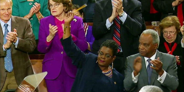 Jan. 20, 2015: Rep. Gwen Moore, D-Wis. waves a pencil in solidarity with the Charlie Hebdo victims during President Obama's State of the Union address.