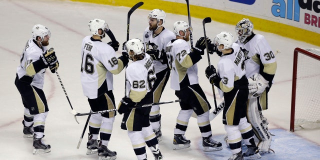 June 6, 2016: The Pittsburgh Penguins celebrate at the end of Game 4 of the NHL Stanley Cup Final against the San Jose Sharks in San Jose, Calif.