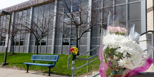April 10, 2014: A bouquet of flowers is taped to a stairway rail near the entrance to Franklin Regional High School near Pittsburgh in Murrysville, Pa. A knife wielding student injured over 20 people in a stabbing attack there on April 9.