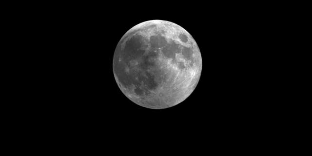 This still from a video skywatching guide shows how the penumbral lunar eclipse of Nov. 28 will slightly darken the full moon. The video guide is a monthly resource by the Space Telescope Science Institute in Maryland.