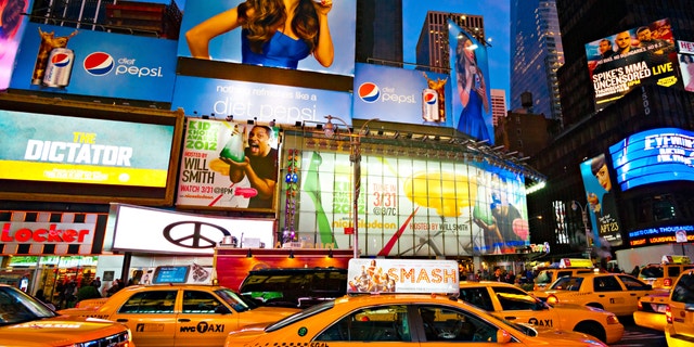 NEW YORK CITY -MARCH 25: Times Square, featured with Broadway Theaters and animated LED signs, is a symbol of New York City and the United States, March 25, 2012 in Manhattan, New York City. USA.