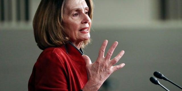 FILE - In this Jan. 11, 2018, file photo, House Minority Leader Nancy Pelosi of Calif., gestures as she speaks during a news conference on Capitol Hill in Washington. On the heels of President Donald Trump's State of the Union address, Pelosi is expected to target the recently approved federal tax overhaul during a town hall-style meeting in Massachusetts. Her appearance at the event in Cambridge on Thursday, Feb. 1, is part of what organizers say is a nationwide tour featuring members of Congress and others to call attention to the Republican tax plan. (AP Photo/Pablo Martinez Monsivais, File)