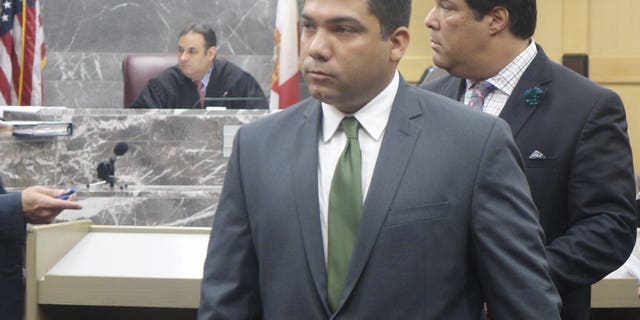 Broward Sheriff’s Deputy Peter Peraza, center, in December.