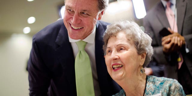 Georgia Republican Sen. David Perdue, left, has emerged as a close Trump ally.