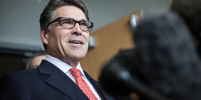 Nov. 6, 2014: Texas Gov. Rick Perry answers questions from the media following a hearing on felony abuse of power charges at the Blackwell-Thurman Criminal Justice Center in Austin, Texas.