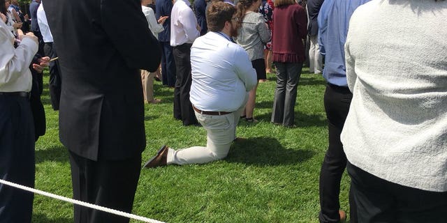 A guest at President Donald Trump's White House event on Tuesday apparently took a knee during the national anthem.