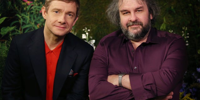 Monday, Dec. 1, 2014. Actor Martin Freeman and director Peter Jackson from New Zealand poses for photographs in promotion for the film "The Hobbit, Battle of the Five Armies" in the Claridges suite in west London.