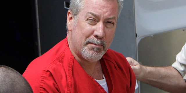 In this May 8, 2009 file photo, former Bolingbrook, Ill., police officer Drew Peterson arrives for court in Joliet, Ill.