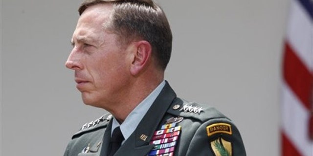Gen. David Petraeus listens as President Obama makes a statement in the Rose Garden in Washington June 23. (AP Photo)
