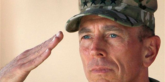 In this July 18 file photo, Gen. David Petraeus salutes during a changing of command ceremony in Kabul, Afghanistan.
