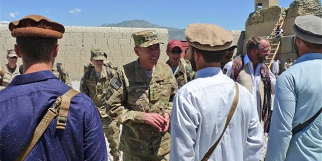 Gen. David Petraeus, center, commander of the NATO International Security Assistance Force (ISAF) meets with special forces in Kunar province in eastern Afghanistan May 8.