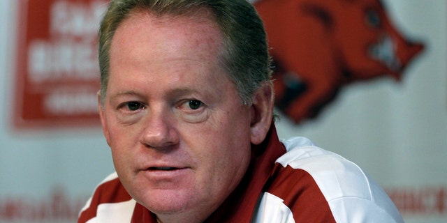 FILE - This Aug. 6, 2011 file photo shows Arkansas college football coach Bobby Petrino speaking to reporters in Fayetteville, Ark.