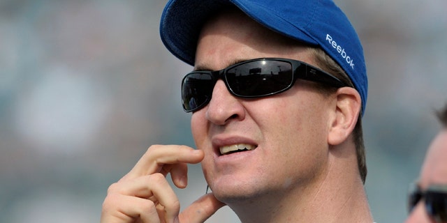 Jan. 1, 2012: FILE - In this file photo, Indianapolis Colts quarterback Peyton Manning watches from the sideline during the first half of an NFL football game against the Jacksonville Jaguars in Jacksonville, Fla.