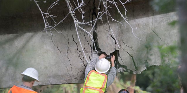 On the rain-soaked coast in Central California, the Pfeiffer Canyon Bridge has crumbled beyond repair, blocking passage on Highway 1 in Big Sur.