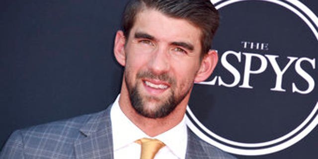 Michael Phelps arrives at the ESPYS at the Microsoft Theater on Wednesday, July 12, 2017, in Los Angeles. (Photo by Jordan Strauss/Invision/AP)