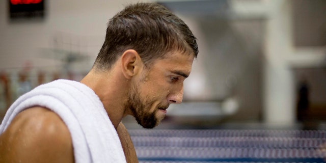 July 11, 2014: In this file photo, Michael Phelps walks away from the starting block after winning the men's 100-meter butterfly at the Bulldog Grand Slam swim meet at the University of Georgia in Athens, Ga. (AP)