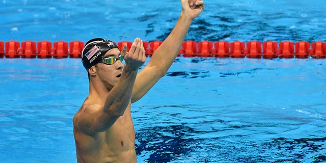United States' Michael Phelps celebrates after winning the gold medal in the men's 200-meter butterfly final during the swimming competitions at the 2016 Summer Olympics, Tuesday, Aug. 9, 2016, in Rio de Janeiro, Brazil. (AP Photo/Martin Meissner)