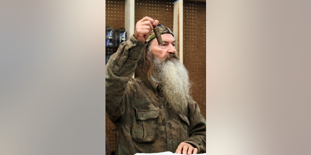 November 7, 2013. Phil Robertson, the Duck Commander, holding the 1 millionth duck call assembled for 2013 at company's warehouse in West Monroe, La.