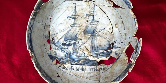 Punch bowl made out of tin glazed earthenware that has the message,“Success to the Tryphena” inscribed on the inside. (Commonwealth Heritage Group)