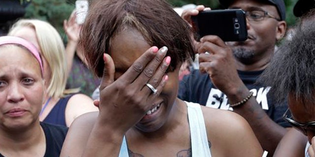 Diamond Reynolds, the girlfriend of Philando Castile of St. Paul, cries outside the governor's residence in St. Paul, Minn., on Thursday, July 7, 2016. Castile was shot and killed after a traffic stop by police in Falcon Heights, Wednesday night. A video shot by Reynolds of the shooting went viral. (AP Photo/Jim Mone)