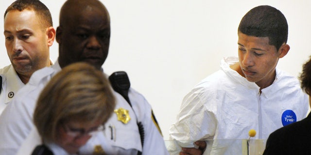 Oct. 23, 2013: Philip Chism, 14, stands during his arraignment for the death of Danvers High School teacher Colleen Ritzer in Salem District Court in Salem, Mass. Chism has been ordered held without bail.