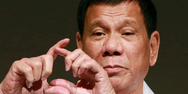 FILE - In this Oct. 26, 2016, file photo, Philippine President Rodrigo Duterte delivers a speech at the Philippine Economic Forum in Tokyo.